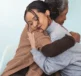 Two women hugging - understanding eczemas impact on mental health with Flexitol