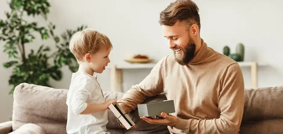 A boy giving his dad the Best Grooming Gift for Father’s Day