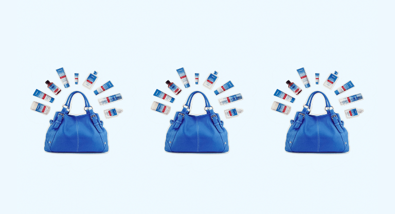 Blue handbag surrounded by multiple Flexitol skincare bottles and tubes arranged in a semicircle